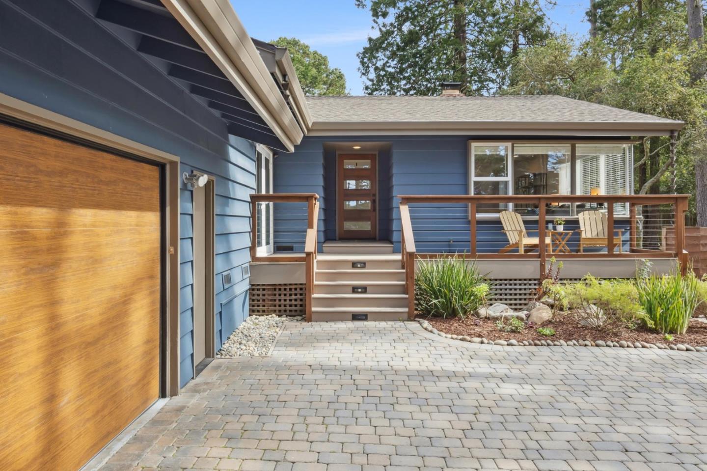 4095 Sunset Lane Pebble Beach, CA 93953 - Photo 2 of 55 a front view of a house with a garden