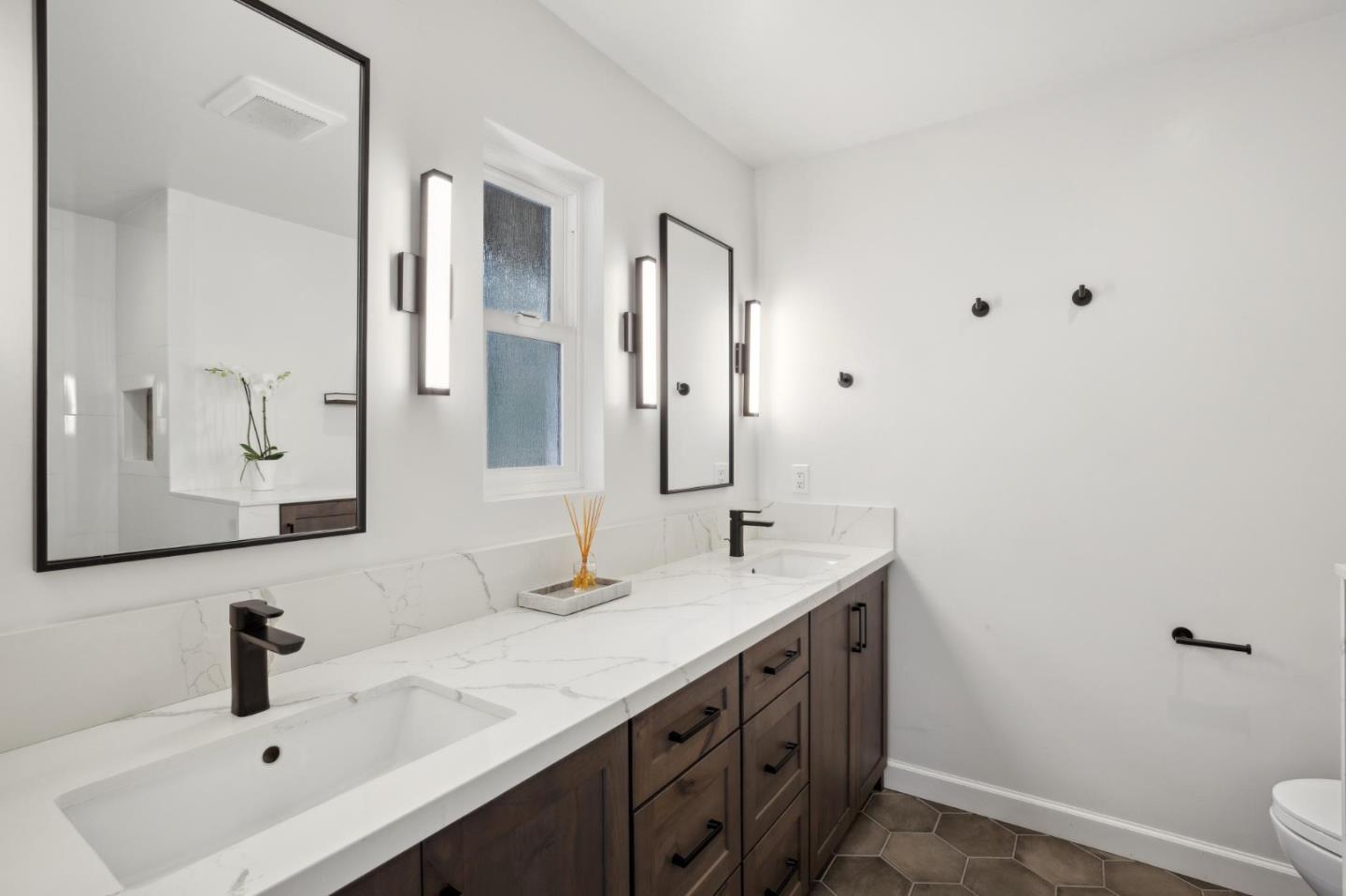 4095 Sunset Lane Pebble Beach, CA 93953 - Photo 24 of 55 a bathroom with a sink and a mirror