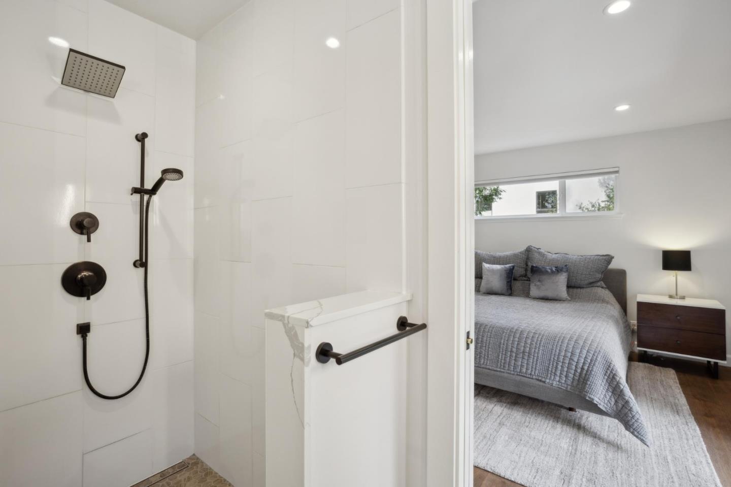 4095 Sunset Lane Pebble Beach, CA 93953 - Photo 26 of 55 a bedroom with a bed and a table