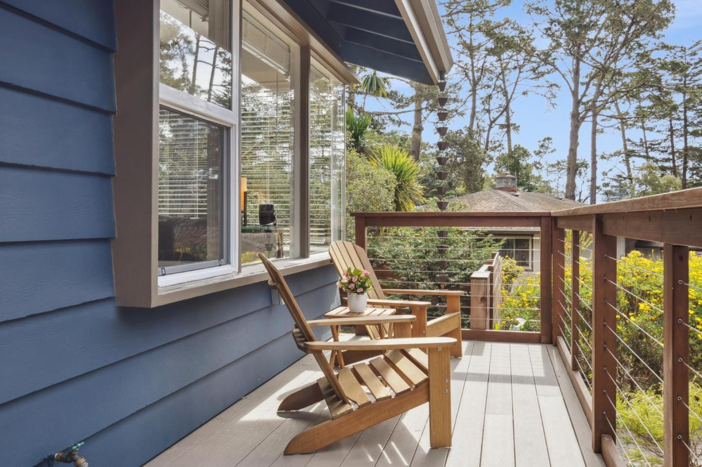 4095 Sunset Lane Pebble Beach, CA 93953 - Photo 3 of 55 a view of a patio with table and chairs and wooden floor