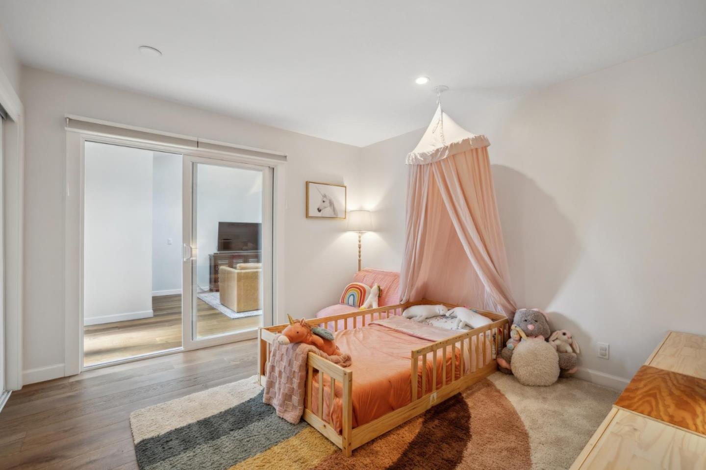 4095 Sunset Lane Pebble Beach, CA 93953 - Photo 31 of 55 a bedroom with a bed and wooden floor