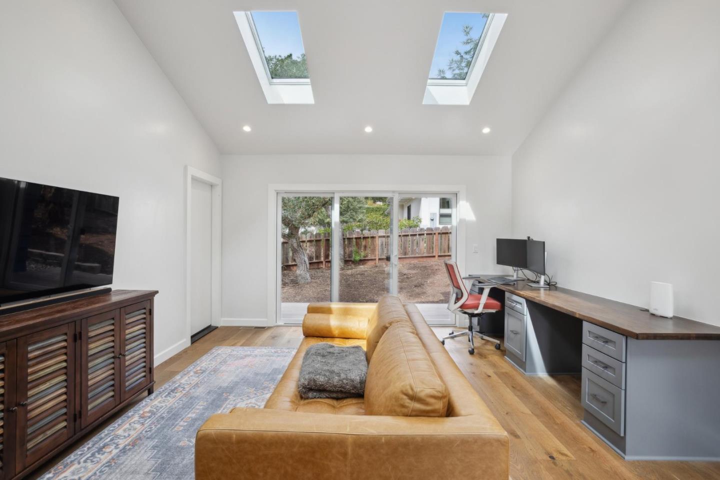 4095 Sunset Lane Pebble Beach, CA 93953 - Photo 34 of 55 a living room with furniture and a flat screen tv
