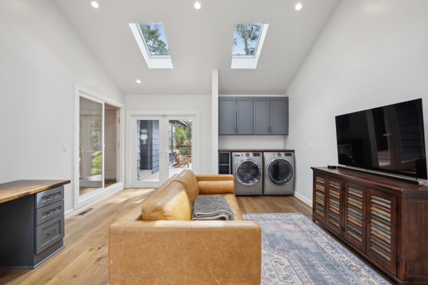 4095 Sunset Lane Pebble Beach, CA 93953 - Photo 36 of 55 a living room with furniture and a flat screen tv