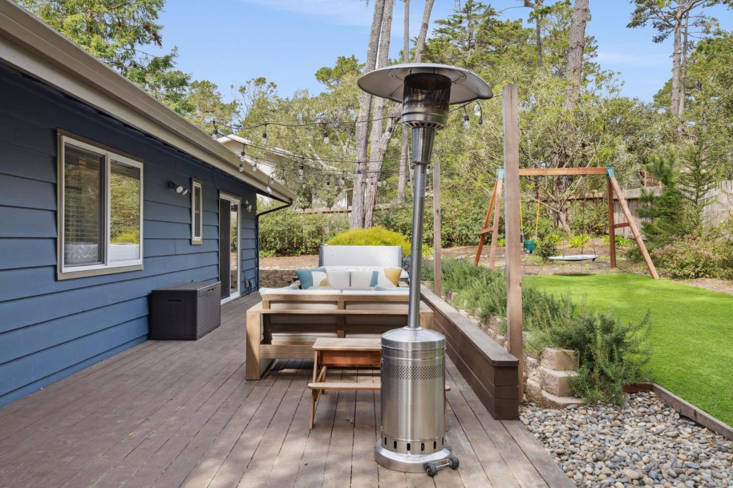 4095 Sunset Lane Pebble Beach, CA 93953 - Photo 41 of 55 a view of a patio with a table and chairs potted plants