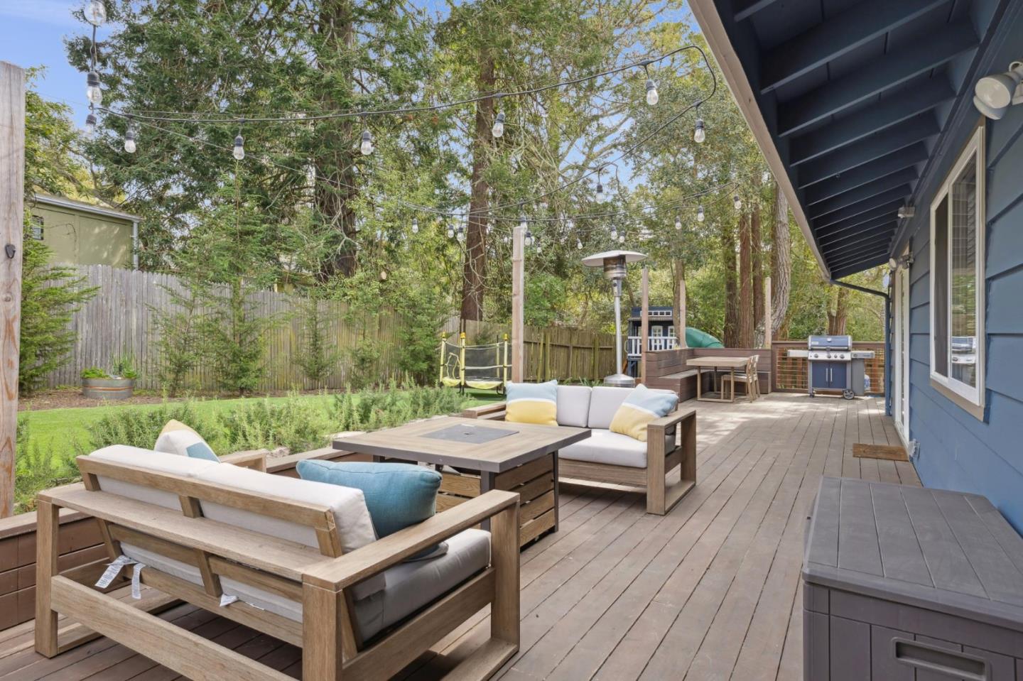 4095 Sunset Lane Pebble Beach, CA 93953 - Photo 49 of 55 a view of a patio with couches chairs and a backyard