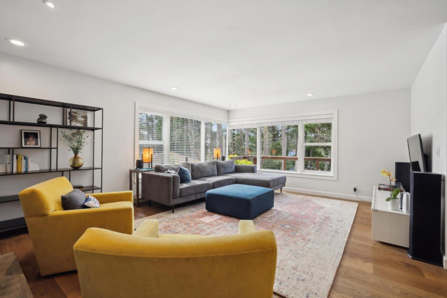 4095 Sunset Lane Pebble Beach, CA 93953 - Photo 9 of 55 a living room with furniture and a flat screen tv