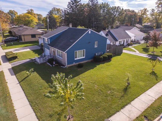 a aerial view of a house with a big yard