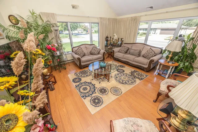 a living room with furniture and a large window