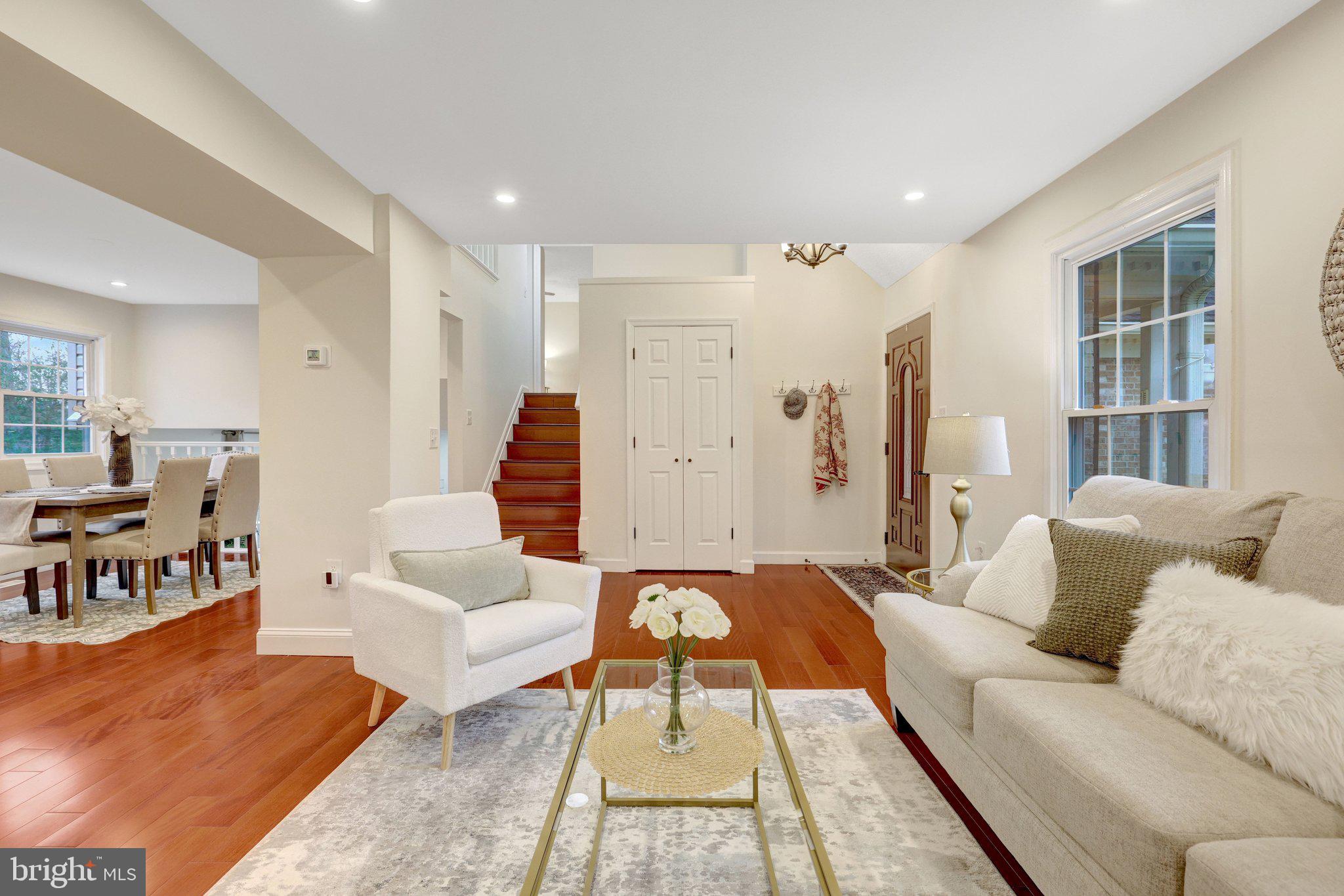 1827 Post Oak Trail Reston, VA 20191 - Photo 13 of 33 a living room with furniture and a rug