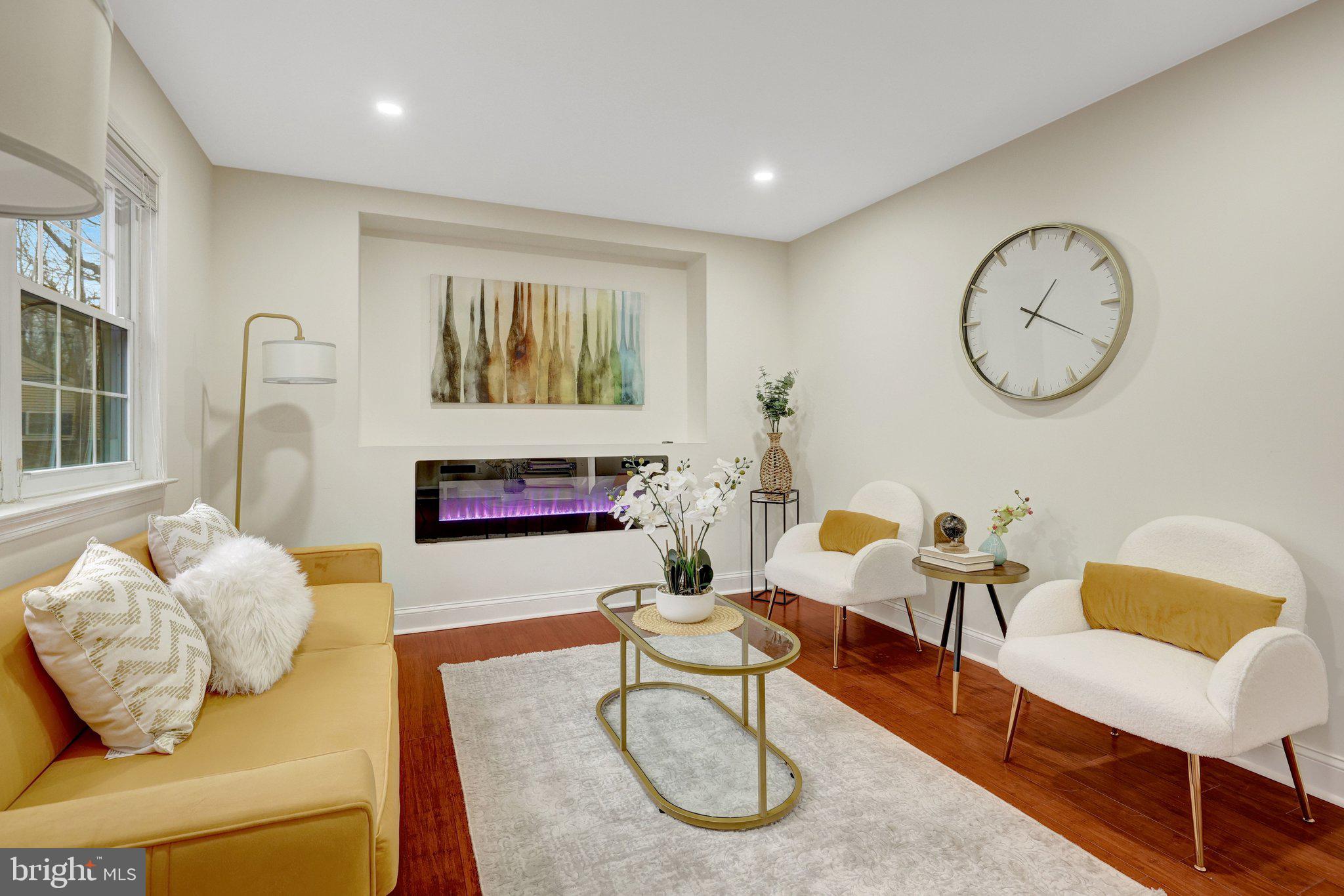 1827 Post Oak Trail Reston, VA 20191 - Photo 14 of 33 a living room with furniture and a fireplace
