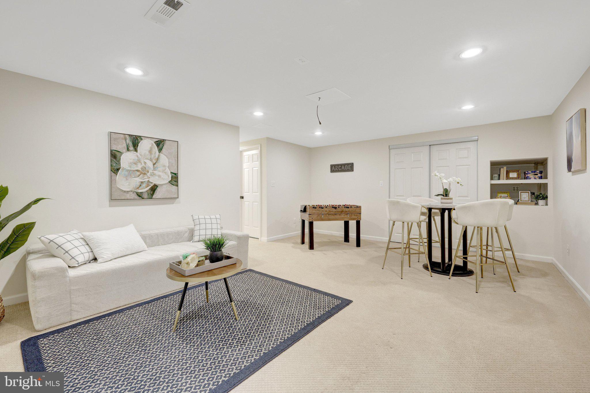 1827 Post Oak Trail Reston, VA 20191 - Photo 20 of 33 a living room with furniture and a table