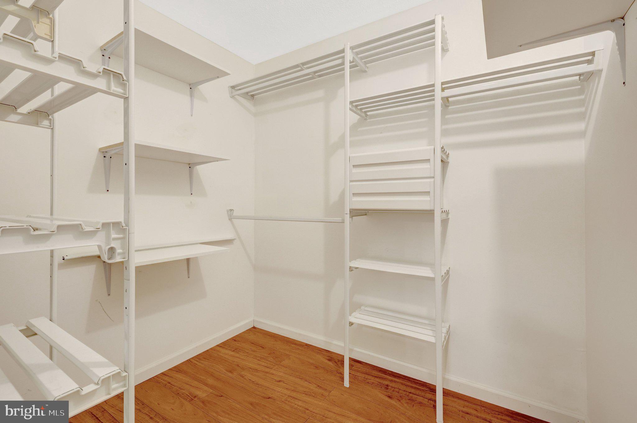 1827 Post Oak Trail Reston, VA 20191 - Photo 27 of 33 a view of walk in closet with empty racks