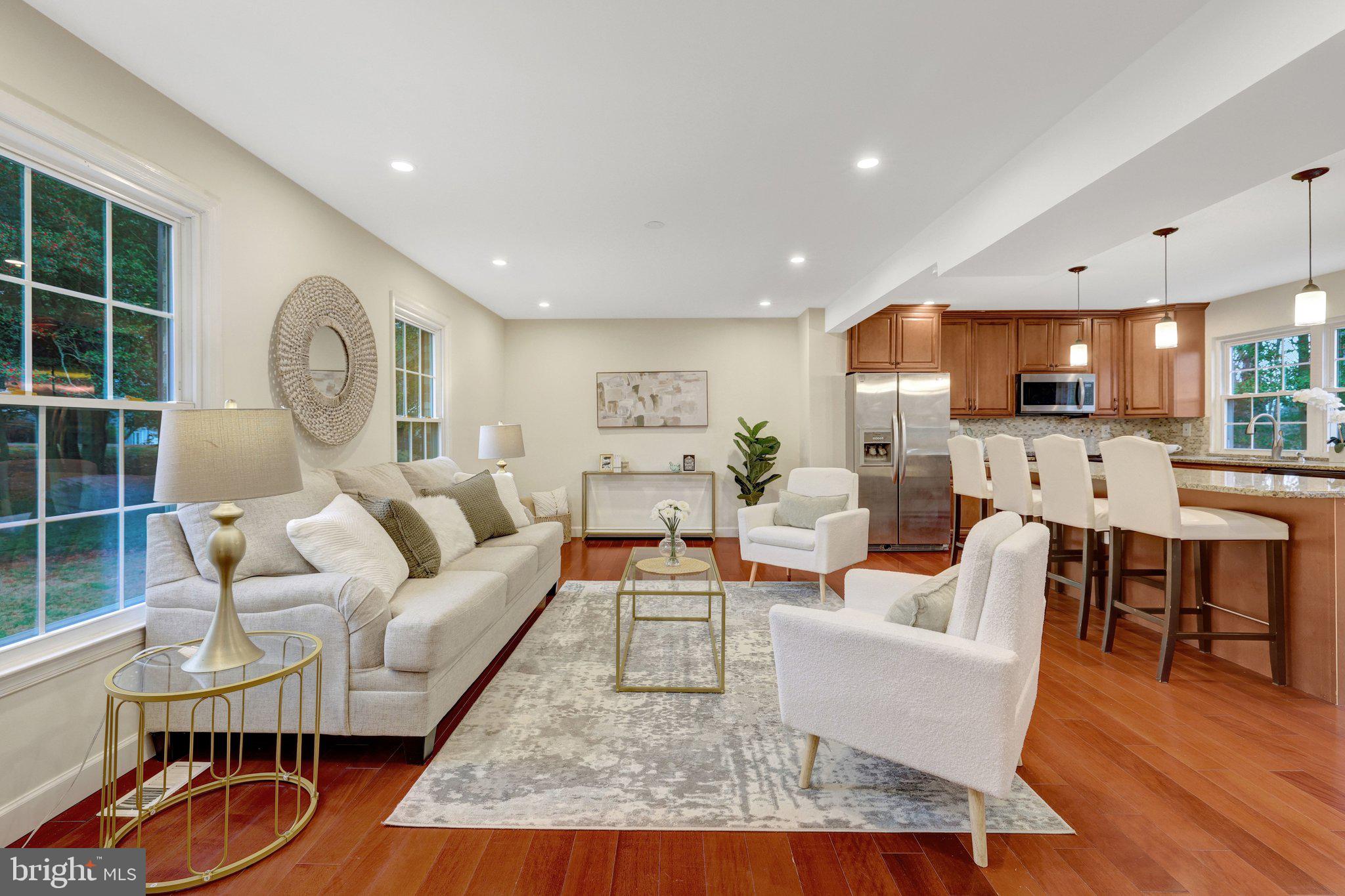 1827 Post Oak Trail Reston, VA 20191 - Photo 3 of 33 a living room with furniture and a wooden floor