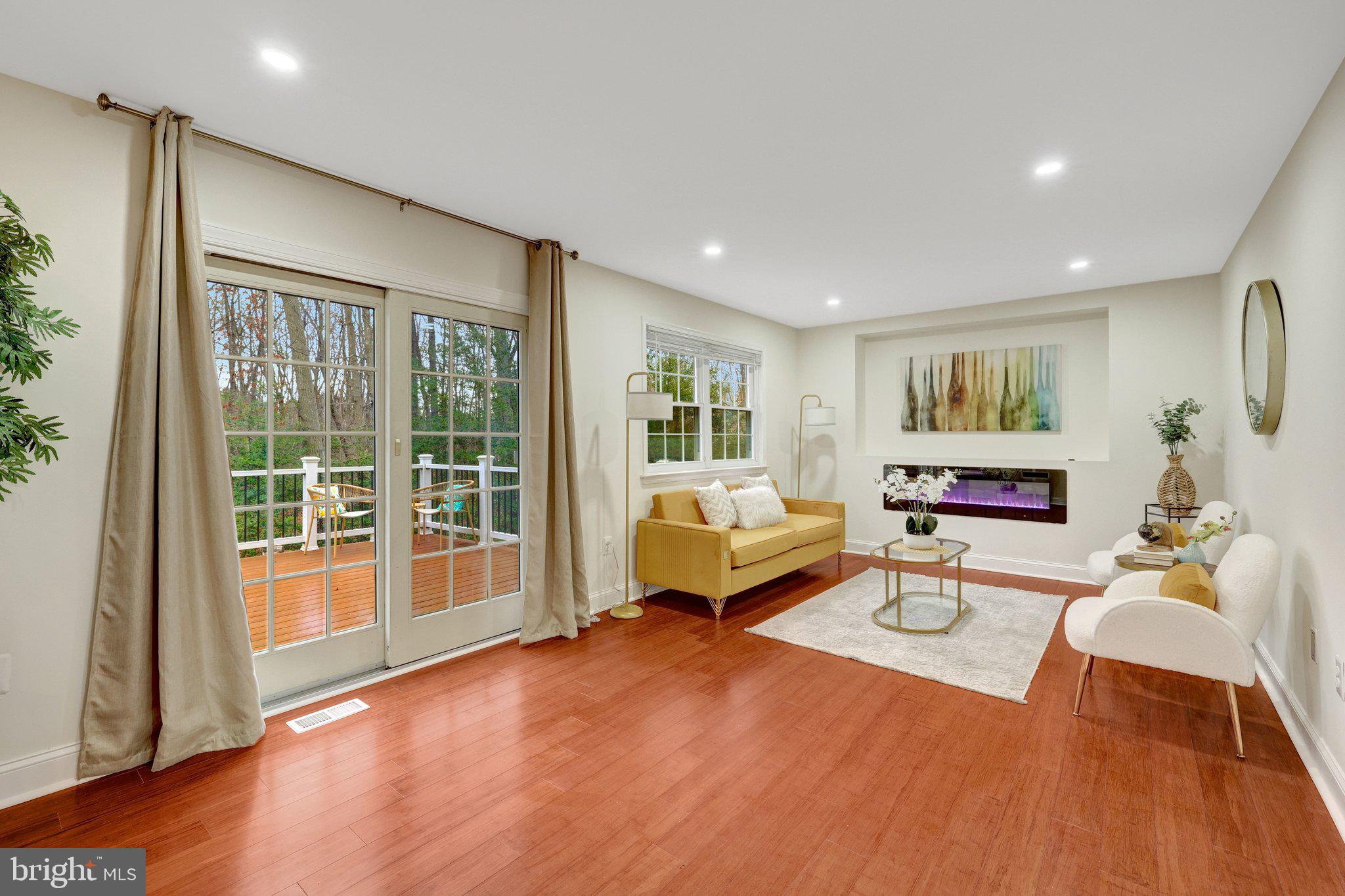 1827 Post Oak Trail Reston, VA 20191 - Photo 4 of 33 a living room with furniture and wooden floor