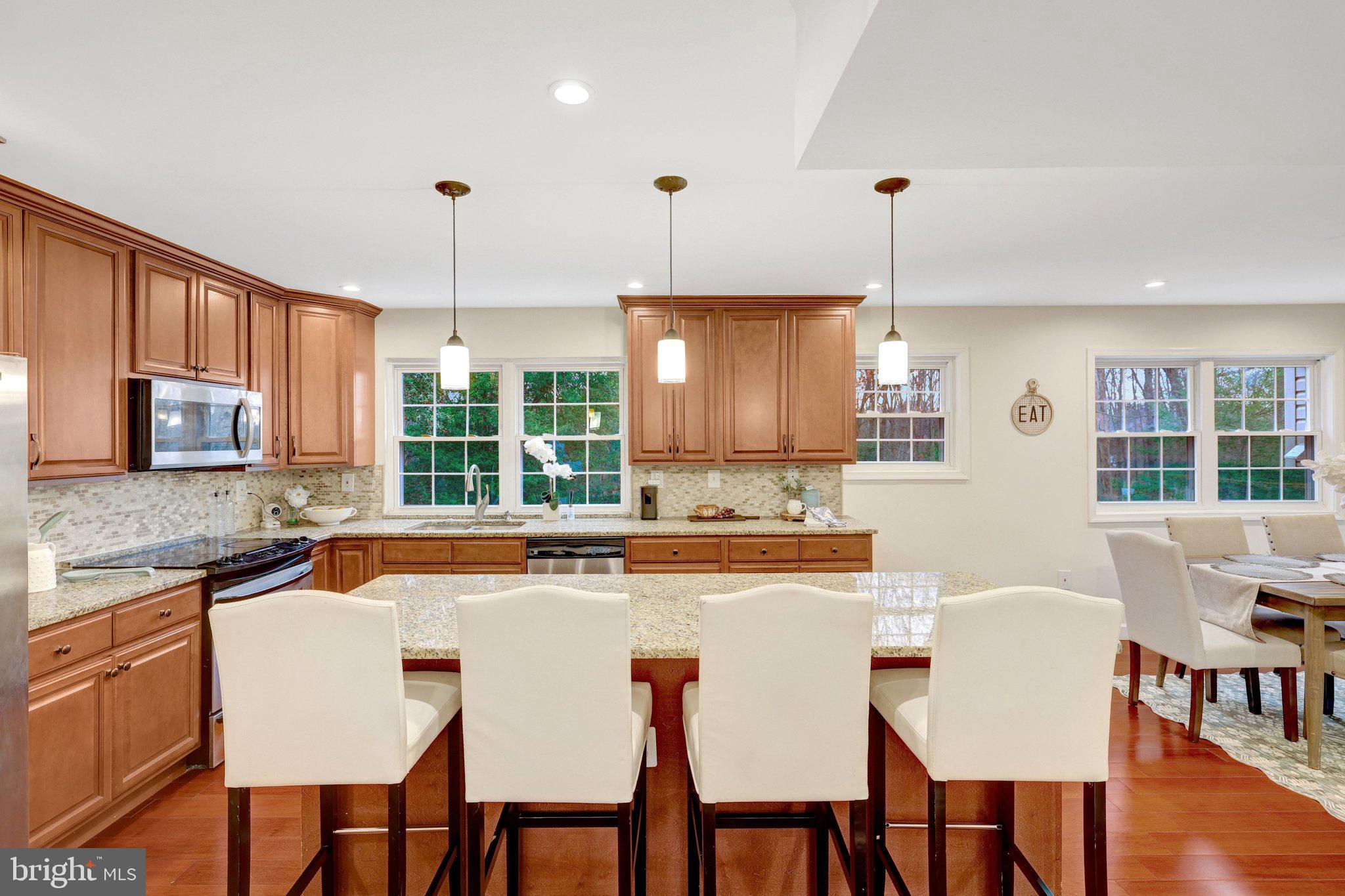 1827 Post Oak Trail Reston, VA 20191 - Photo 9 of 33 a dining table with chairs and window