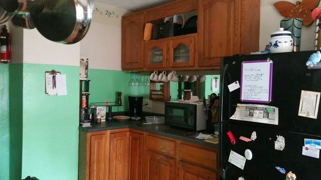 175 Lang Street Springfield, MA 01104 - Photo 5 of 28 a kitchen with lots of counter top space and wooden floor