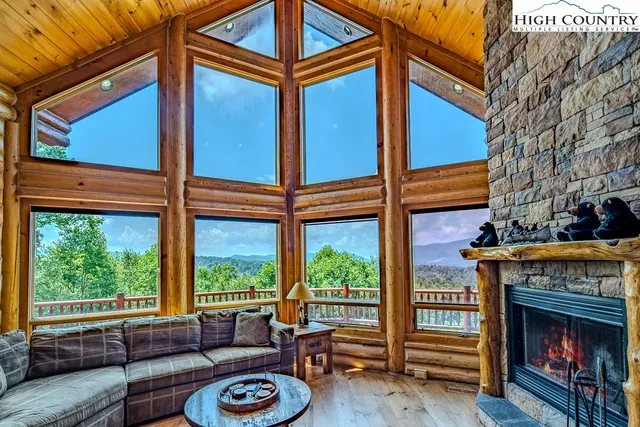 a outdoor space with patio the couches and a fireplace