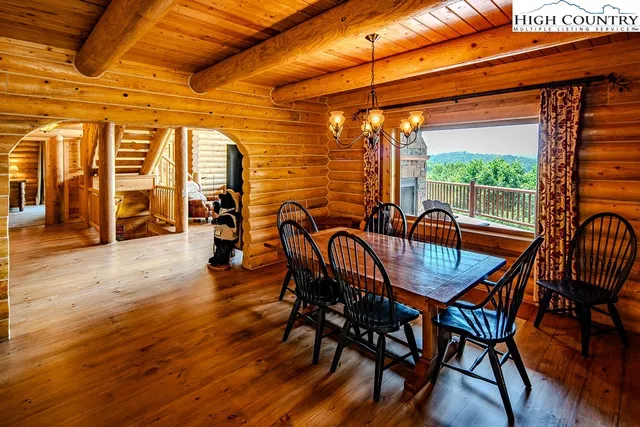 a dining room with furniture and wooden floor