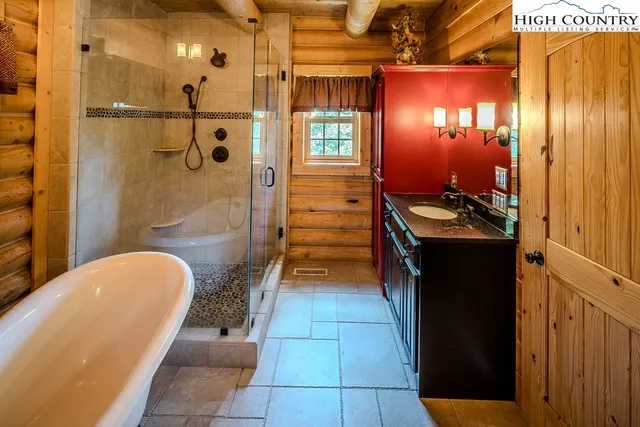 a lobby with furniture and floor to ceiling window