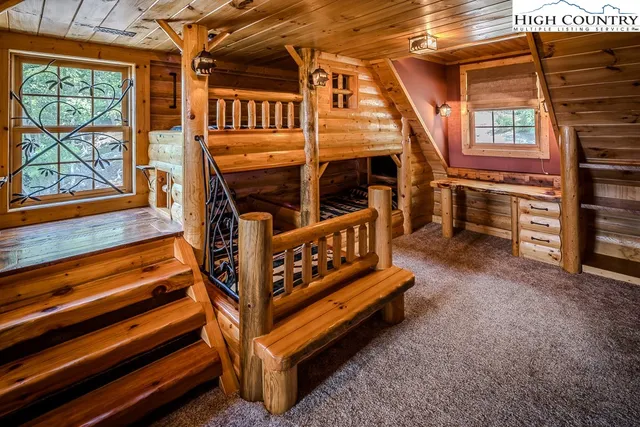 a view of a chairs setting in the backyard