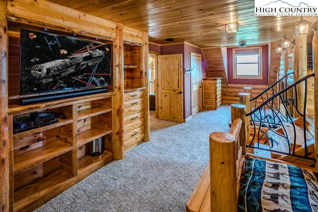 a bathroom with a double vanity sink and mirror with bathtub