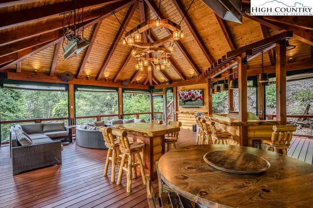 a dining room with furniture window and wooden floor