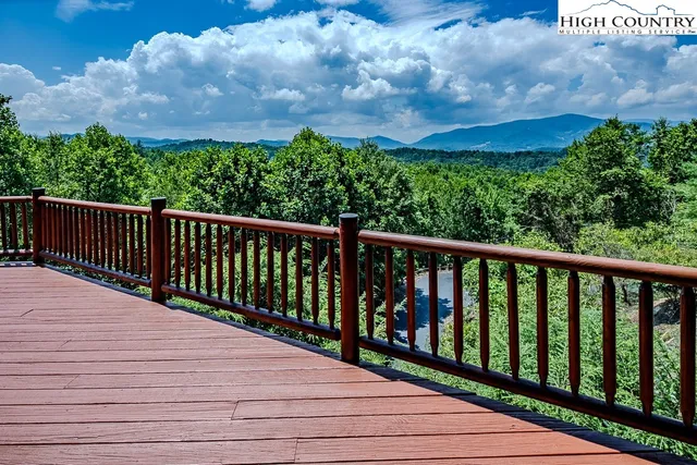 a balcony with wooden floor in back
