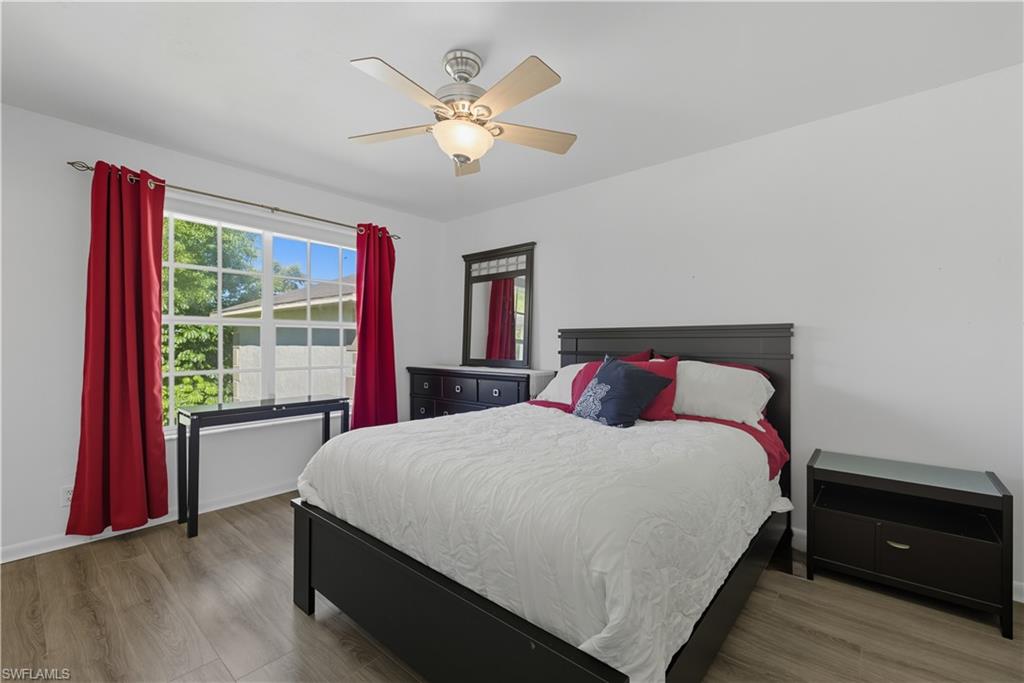 5356 16th Place Southwest, Unit G4 Naples, FL 34116 - Photo 11 of 23 a bedroom with a bed and a window