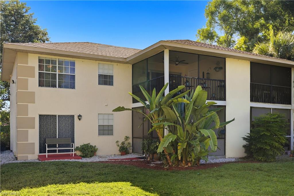 5356 16th Place Southwest, Unit G4 Naples, FL 34116 - Photo 3 of 23 a front view of house with yard
