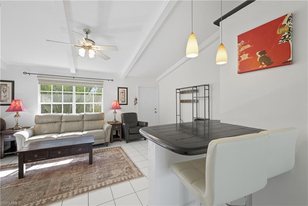 5356 16th Place Southwest, Unit G4 Naples, FL 34116 - Photo 9 of 23 a living room with furniture and window