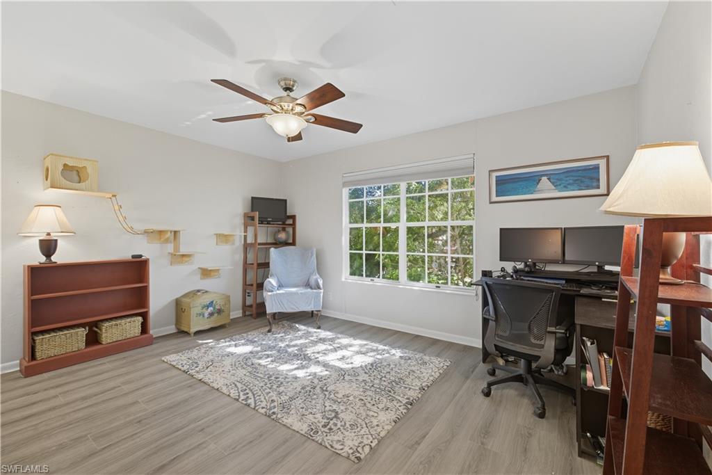 5356 16th Place Southwest, Unit G4 Naples, FL 34116 - Photo 10 of 23 a workspace with furniture hardwood and a window
