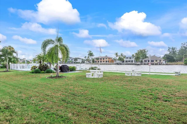 a view of a porch with a table and chairs