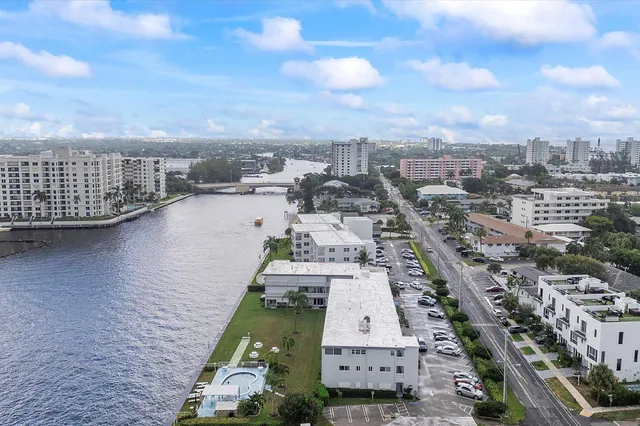 an aerial view of a house with a lake view
