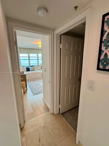 a bedroom with a bed and a mirror