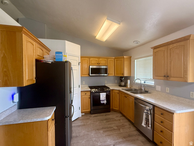 1353 360 West Payson, UT 84651 - Photo 6 of 16 Kitchen featuring light wood cabinetry, laminate countertops, wood-finish flooring, and a stainless steel dishwasher