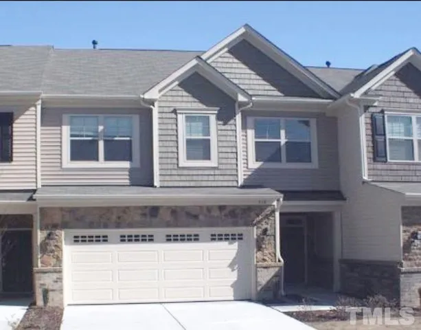 a front view of a house with a garage