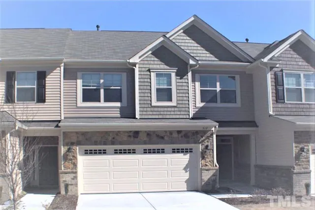 a kitchen with stainless steel appliances granite countertop a stove a sink dishwasher and a refrigerator