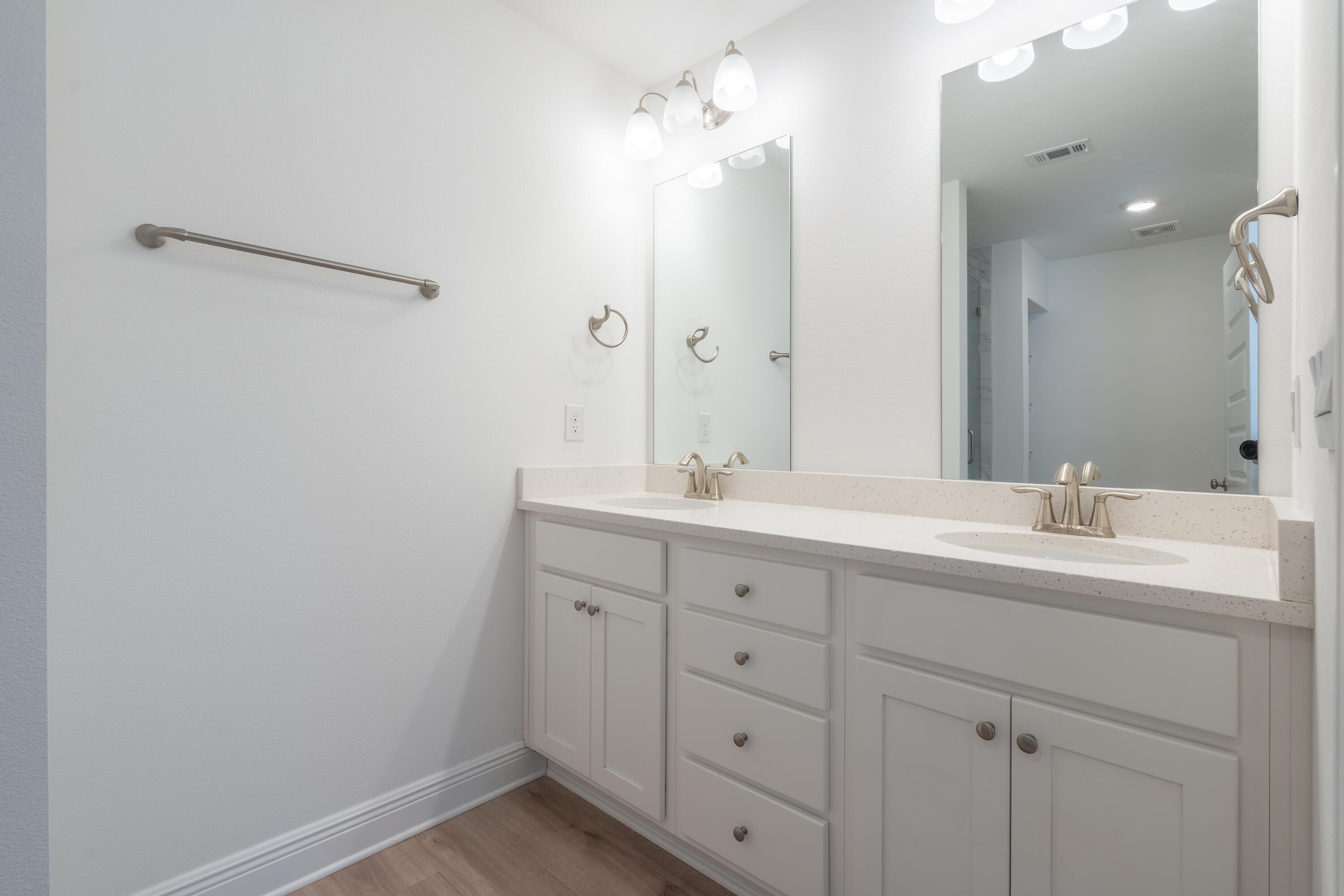 38 Redbird Loop Destin, FL 32541 - Photo 12 of 23 a bathroom with a double vanity sink and mirror with shower