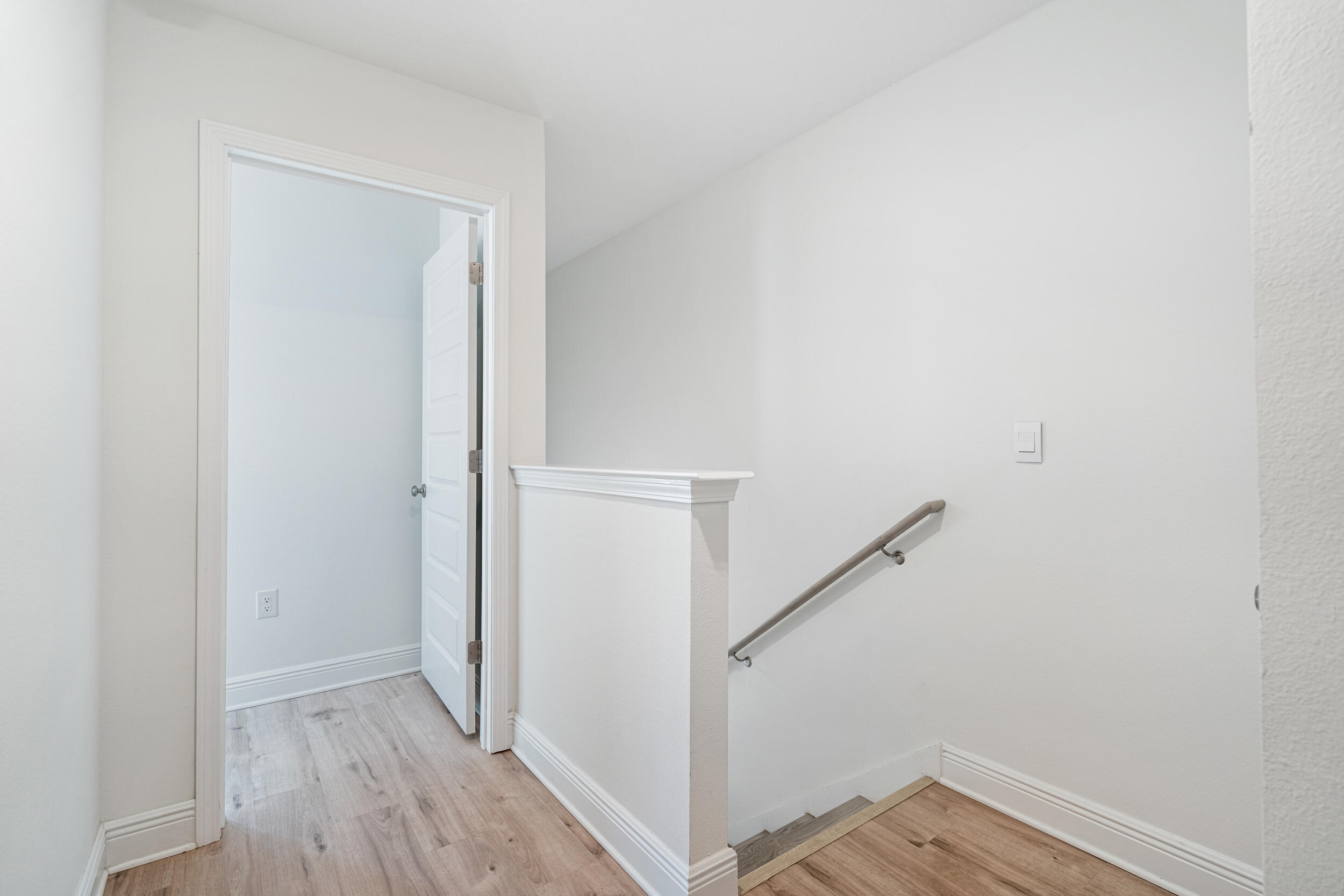 38 Redbird Loop Destin, FL 32541 - Photo 17 of 23 a view of a hallway with wooden floor and entryway