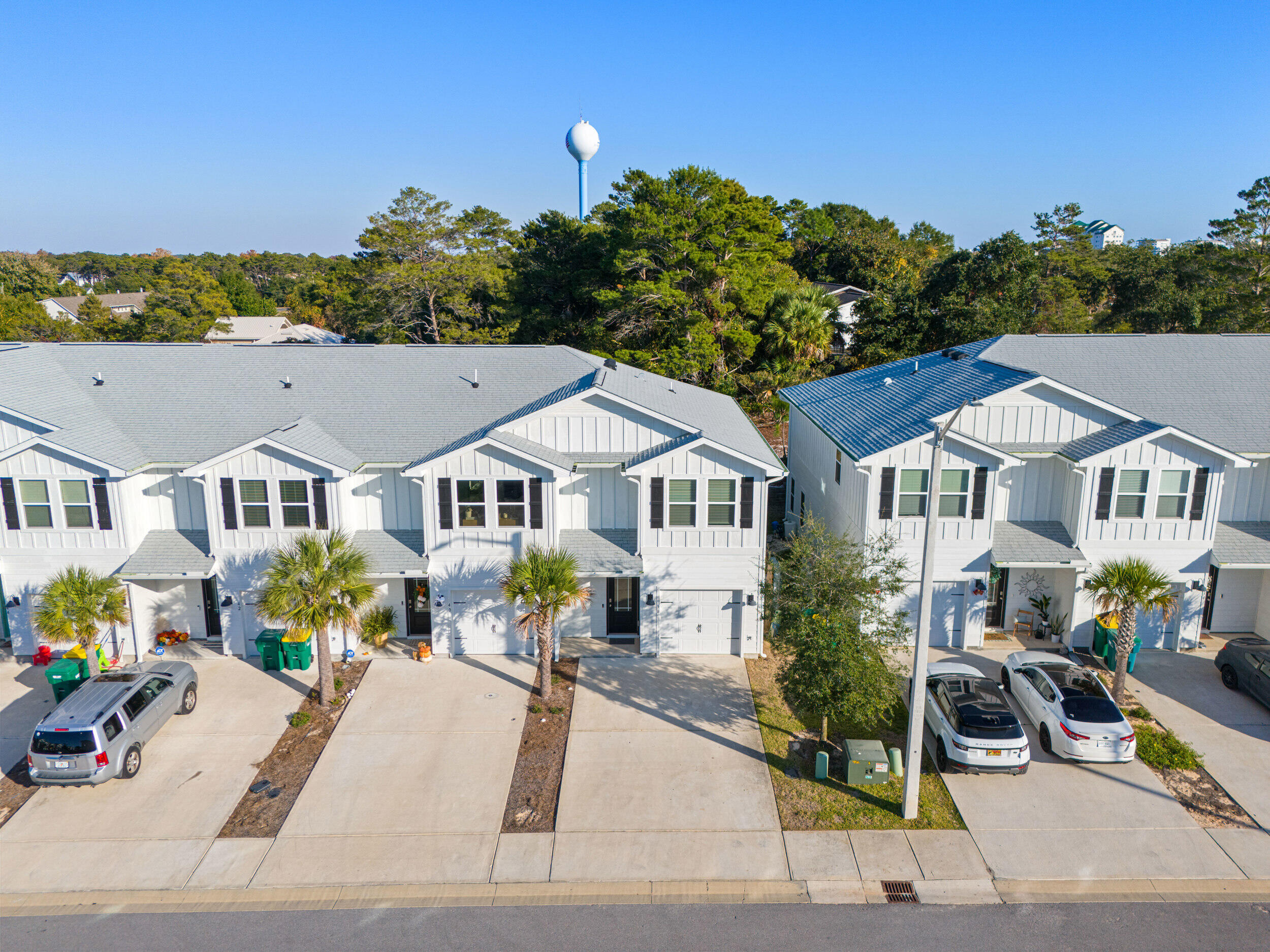 38 Redbird Loop Destin, FL 32541 - Photo 21 of 23 a front view of a house with a garden