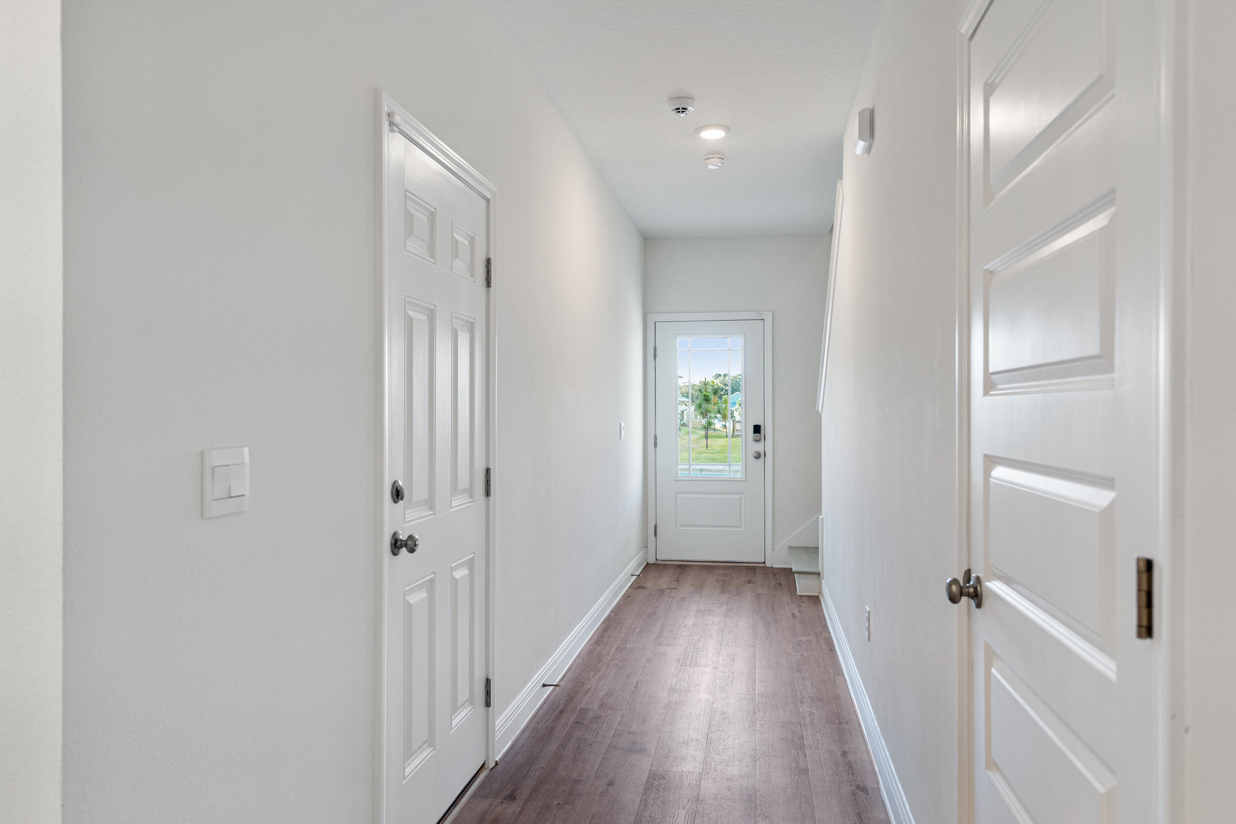 38 Redbird Loop Destin, FL 32541 - Photo 4 of 23 a view of a hallway with wooden floor