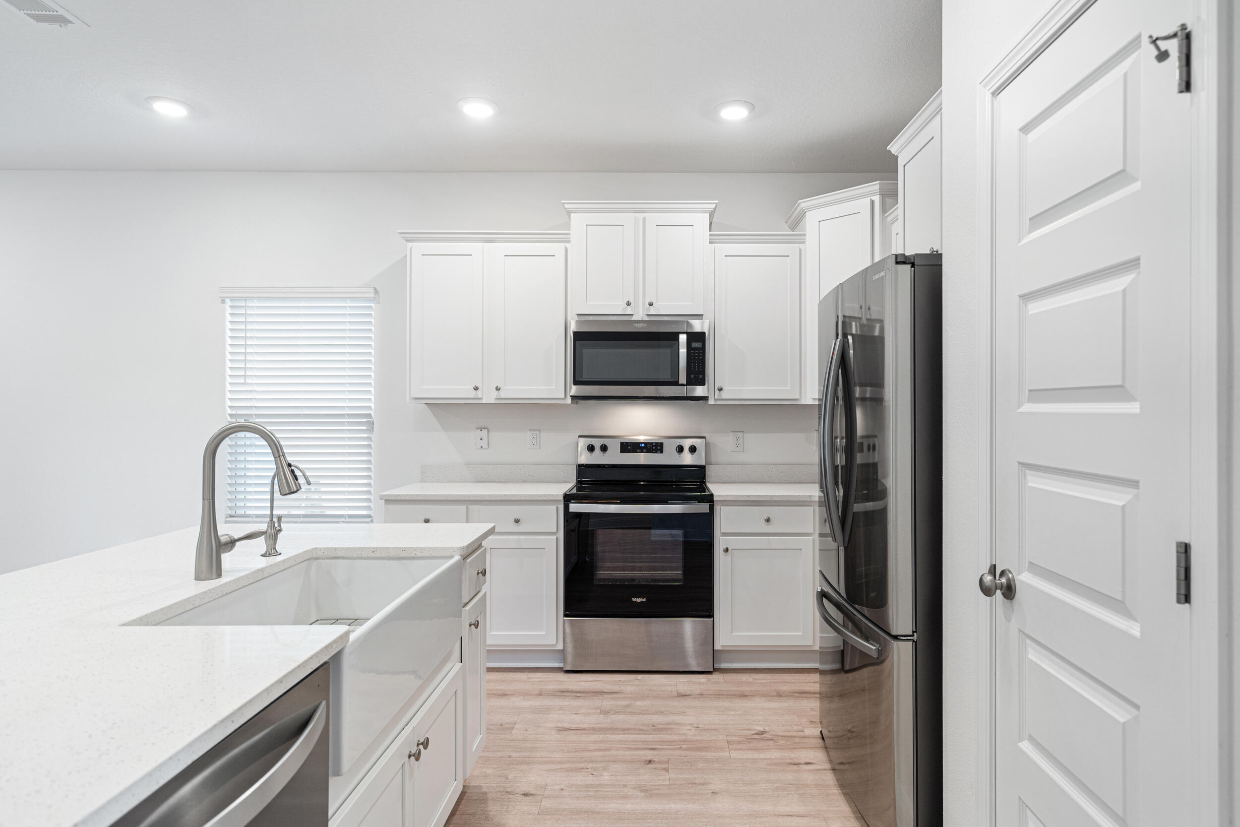 38 Redbird Loop Destin, FL 32541 - Photo 6 of 23 a kitchen with a sink stainless steel appliances and cabinets