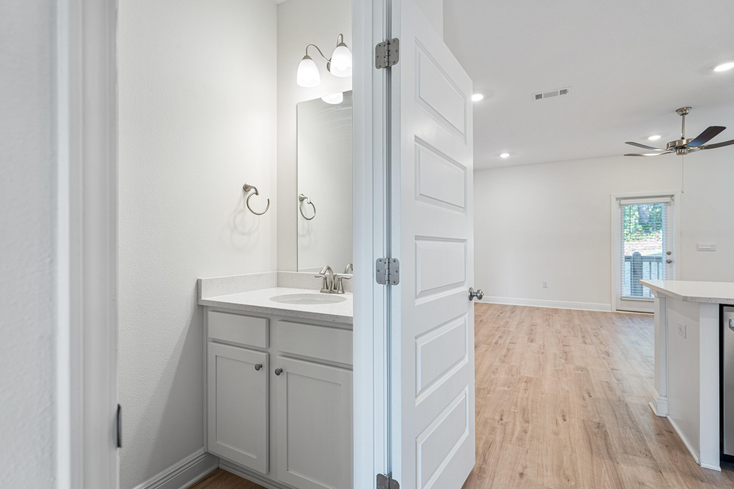 38 Redbird Loop Destin, FL 32541 - Photo 9 of 23 a view of bathroom with a sink mirror and wooden floor