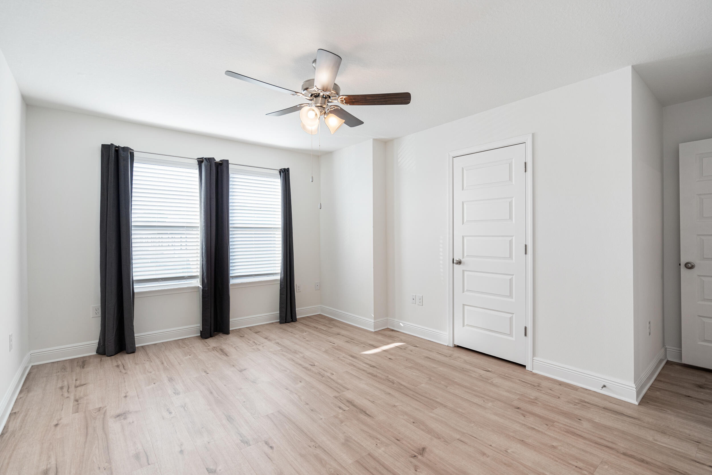 38 Redbird Loop Destin, FL 32541 - Photo 10 of 23 an empty room with wooden floor closet and windows