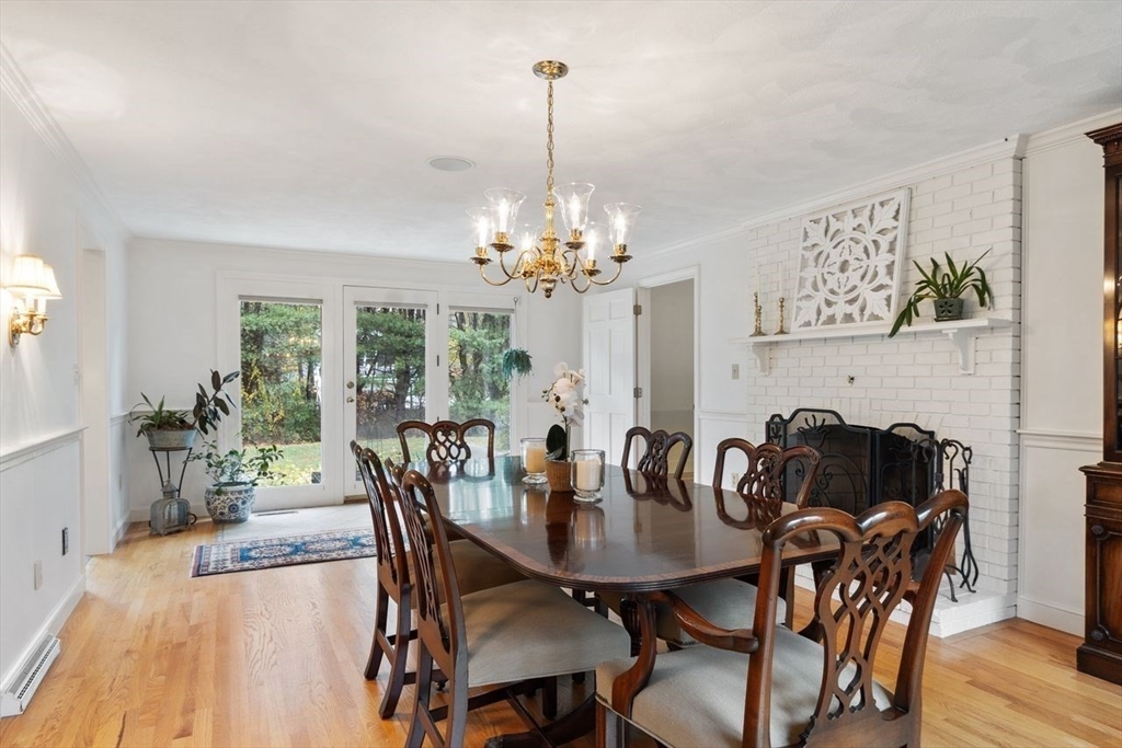 50 Hidden Road Andover, MA 01810 - Photo 13 of 42 a view of a dining room with furniture and wooden floor