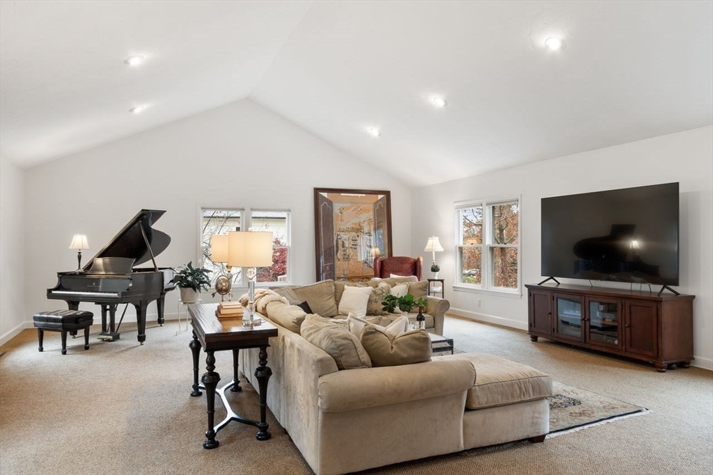 50 Hidden Road Andover, MA 01810 - Photo 14 of 42 a living room with furniture and a flat screen tv