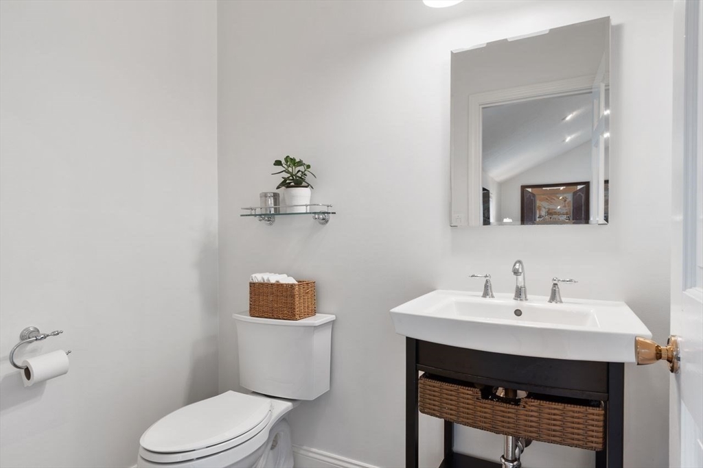 50 Hidden Road Andover, MA 01810 - Photo 17 of 42 a bathroom with a toilet a sink and mirror