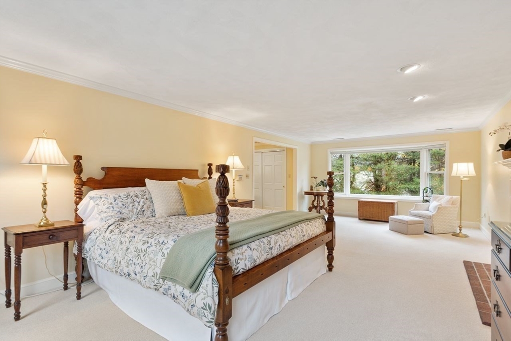 50 Hidden Road Andover, MA 01810 - Photo 20 of 42 a bedroom with a large bed and large window