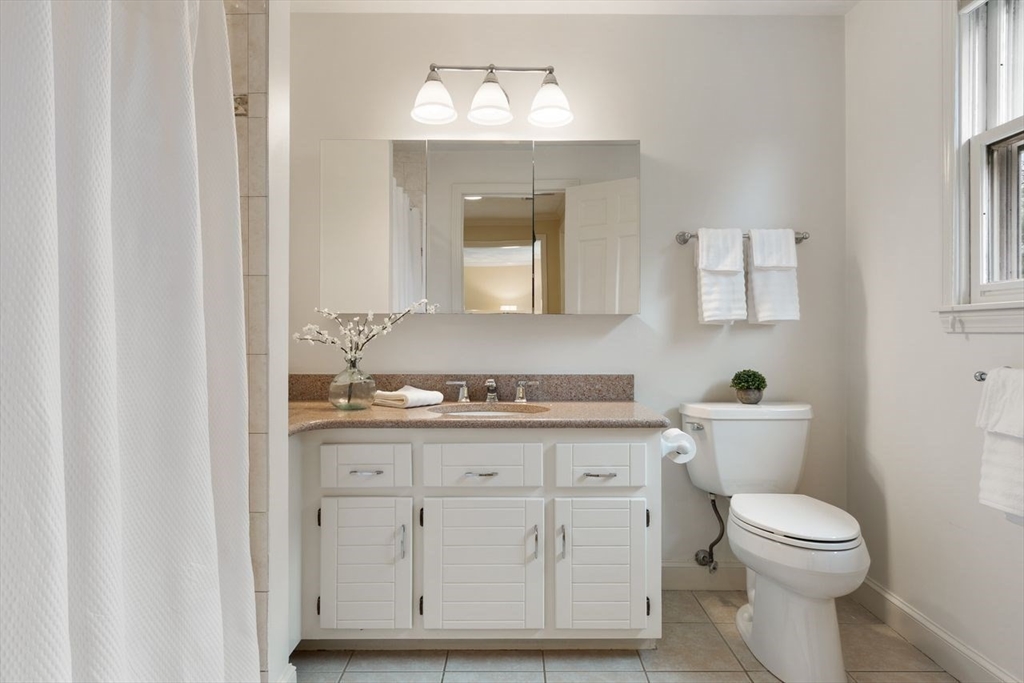 50 Hidden Road Andover, MA 01810 - Photo 23 of 42 a bathroom with a toilet sink and mirror