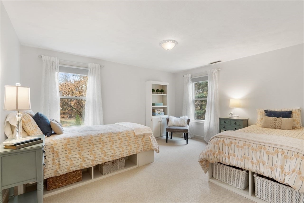 50 Hidden Road Andover, MA 01810 - Photo 25 of 42 a bedroom with a bed and wooden floor